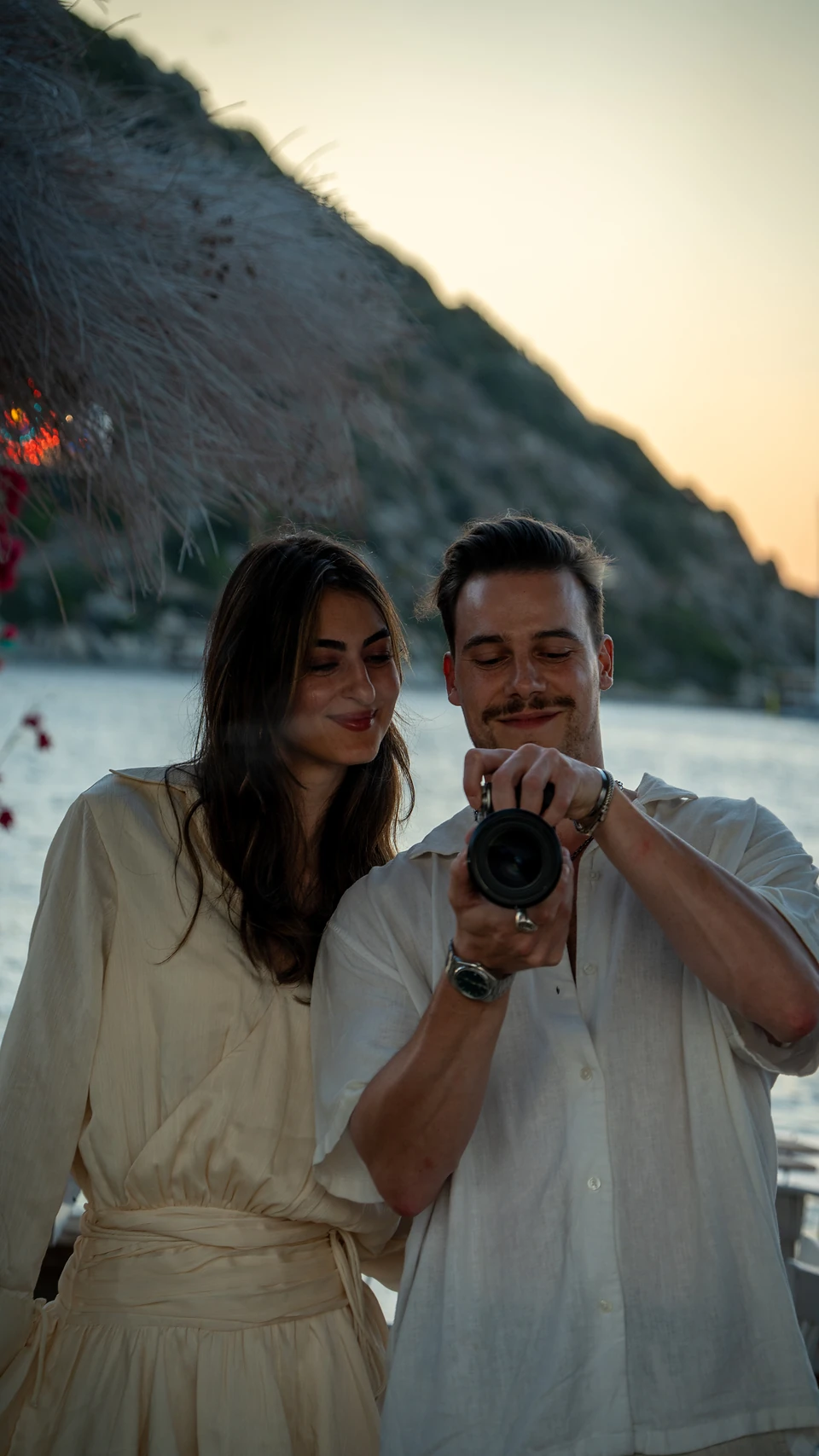The two of us checking a shot on the camera in Gümüşlük at dusk